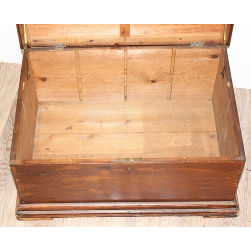 192 - Vintage pine trunk with campaign style brass handles, 62 W x 44 D x 29cm H