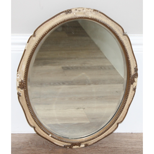 596 - 2 mirrors to incl an oval shaped easel-backed mirror with beaded frame, and a wooden-framed wall mir... 