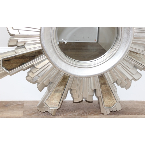 639 - Retro silver coloured sunburst design wall mirror, approx 100cm diam