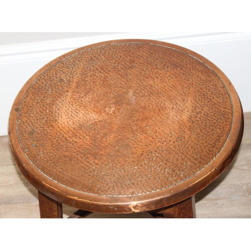 56 - A pair of early 20th century copper top circular tables with X cross stretchers, possibly Tavern tab... 