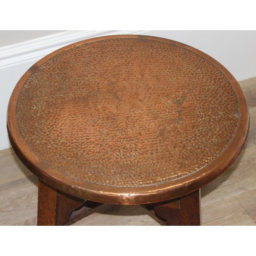 56 - A pair of early 20th century copper top circular tables with X cross stretchers, possibly Tavern tab... 