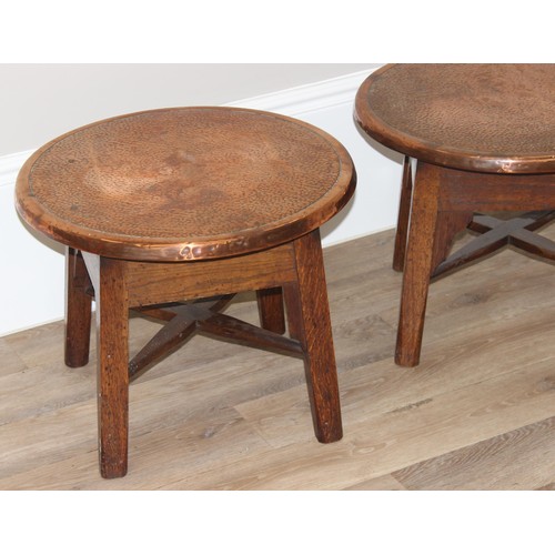 56 - A pair of early 20th century copper top circular tables with X cross stretchers, possibly Tavern tab... 