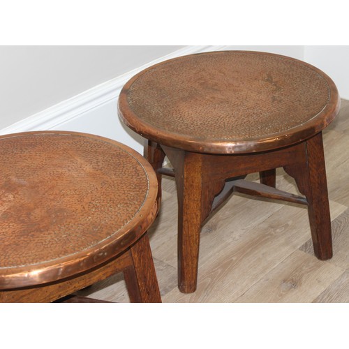 56 - A pair of early 20th century copper top circular tables with X cross stretchers, possibly Tavern tab... 