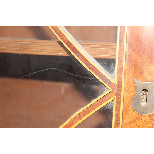 154 - A George III mahogany Secrétaire bookcase, with astragal glazed doors above 5 drawers, the top 2 fit... 