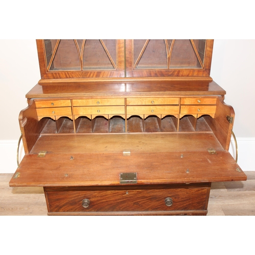 154 - A George III mahogany Secrétaire bookcase, with astragal glazed doors above 5 drawers, the top 2 fit... 