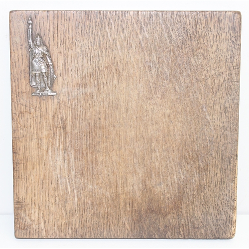 1022 - An unusual oak chopping board mounted with a silver Viking, hallmarks obscured but XRF confirmed as ... 