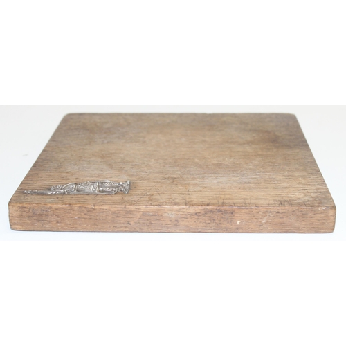 1022 - An unusual oak chopping board mounted with a silver Viking, hallmarks obscured but XRF confirmed as ... 