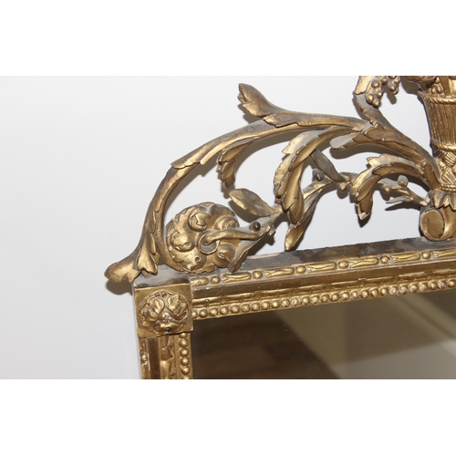 458 - Antique gilt framed mirror with decorative carved wooden fruit and scrolls to top, likely 19th centu... 