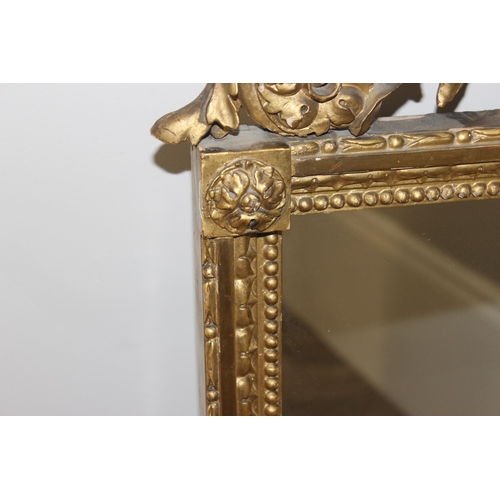 458 - Antique gilt framed mirror with decorative carved wooden fruit and scrolls to top, likely 19th centu... 