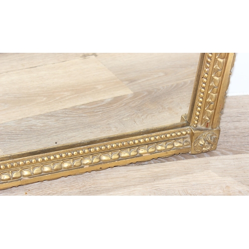 458 - Antique gilt framed mirror with decorative carved wooden fruit and scrolls to top, likely 19th centu... 