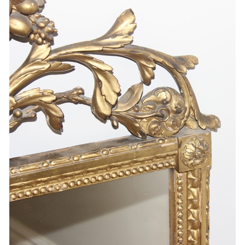 458 - Antique gilt framed mirror with decorative carved wooden fruit and scrolls to top, likely 19th centu... 