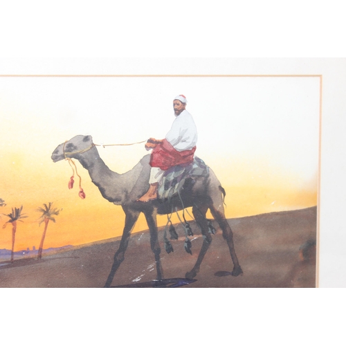 548 - Giovanni Barbaro (Italian, 1864-1915), watercolour of a male riding a camel near and oasis at sunset... 