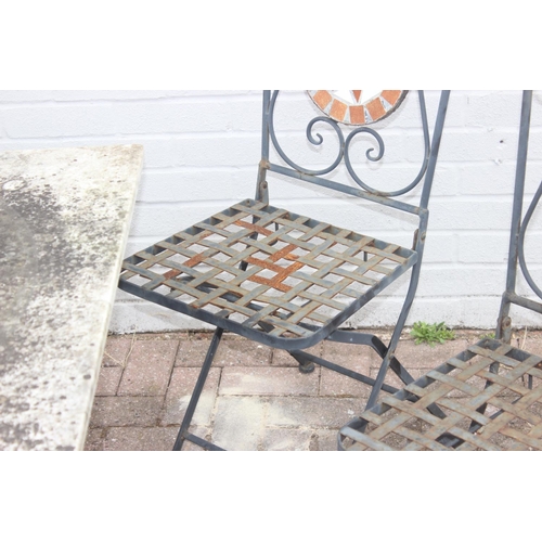 312 - Loose-topped marble garden table with cast iron base and 4 folding mosaic-backed wrought iron garden... 