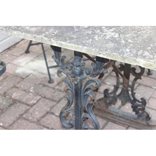 312 - Loose-topped marble garden table with cast iron base and 4 folding mosaic-backed wrought iron garden... 