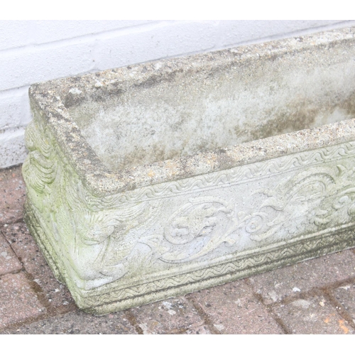 319 - Pair of oblong concrete planters with scrolled design, approx 72 x 24 x 26cm