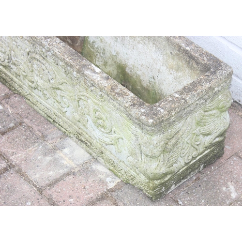 319 - Pair of oblong concrete planters with scrolled design, approx 72 x 24 x 26cm