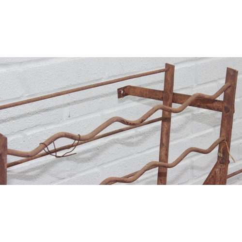 323 - 2 weathered wall mountable wine racks, total hold of 200 bottles