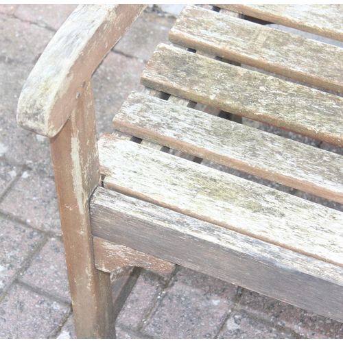 324 - Teak oblong garden table for John Lewis, approx 180cm x 90cm x 75cm, and a teak garden bench (2)