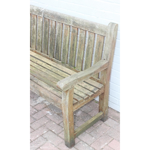 325 - Teak garden bench, and a small wooden garden table with cross banded legs, both by Woodfurn, bench a... 