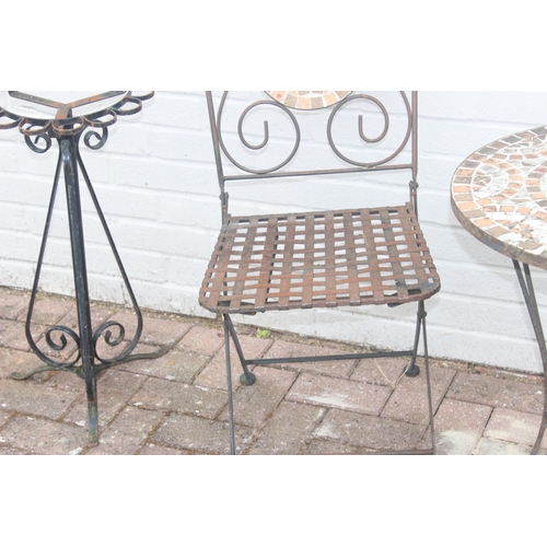 327 - Wrought iron bistro set, comprising 2 mosaic backed chairs and table, with further wrought iron tabl... 