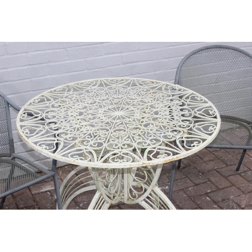 329 - White painted metal round garden table with rocket style base, and a set of 4 metal garden chairs, t... 