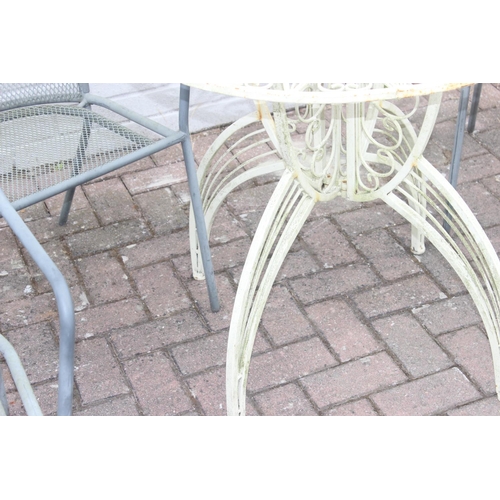 329 - White painted metal round garden table with rocket style base, and a set of 4 metal garden chairs, t... 