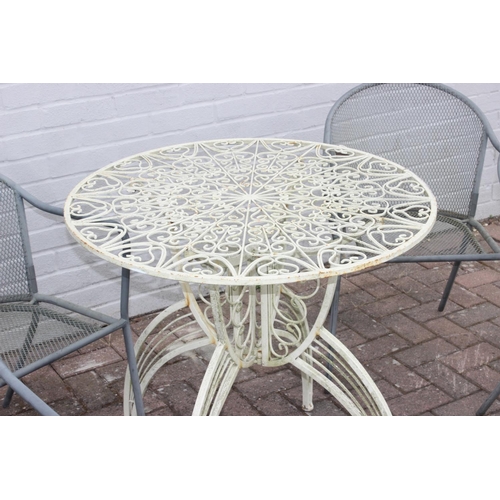 329 - White painted metal round garden table with rocket style base, and a set of 4 metal garden chairs, t... 