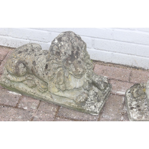 341 - Pair of concrete lion garden statues/ornaments, approx 55cm long x 40cm H