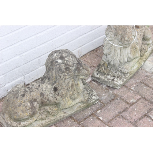 341 - Pair of concrete lion garden statues/ornaments, approx 55cm long x 40cm H