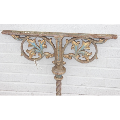 344 - Pair of cast iron table base legs with Fleur de Lys motifs and twisted supports, each with part pain... 