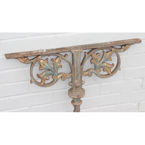 344 - Pair of cast iron table base legs with Fleur de Lys motifs and twisted supports, each with part pain... 