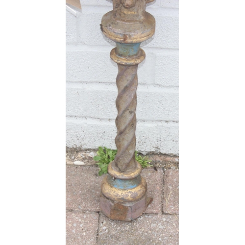 344 - Pair of cast iron table base legs with Fleur de Lys motifs and twisted supports, each with part pain... 