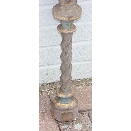 344 - Pair of cast iron table base legs with Fleur de Lys motifs and twisted supports, each with part pain... 