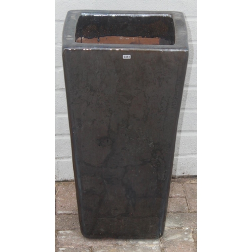 351 - A black glazed ceramic garden pot of square tapered form, approx 34cm square x 61cm tall