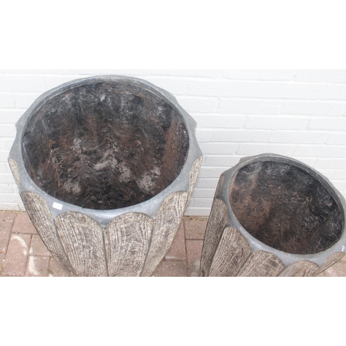 352 - 2 fiberglass garden planters of ribbed bark effect form, the largest approx 46cm x 92cm