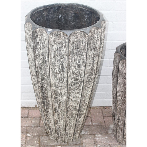 352 - 2 fiberglass garden planters of ribbed bark effect form, the largest approx 46cm x 92cm