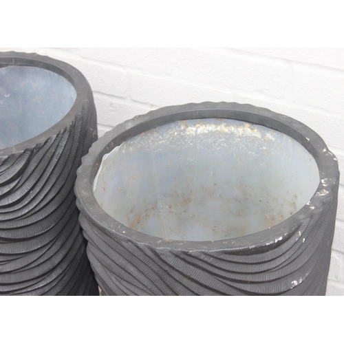 353 - A pair of black fiberglass planters of wavy textured form, approx 39cm x 75cm