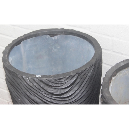 353 - A pair of black fiberglass planters of wavy textured form, approx 39cm x 75cm