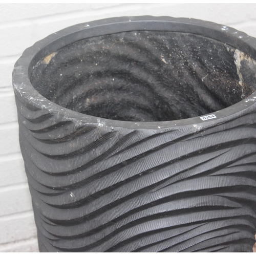 354 - A pair of black fiberglass planters of wavy textured form, approx 39cm x 75cm