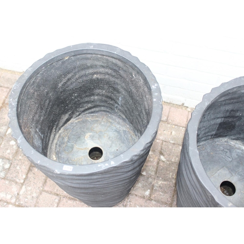 354 - A pair of black fiberglass planters of wavy textured form, approx 39cm x 75cm