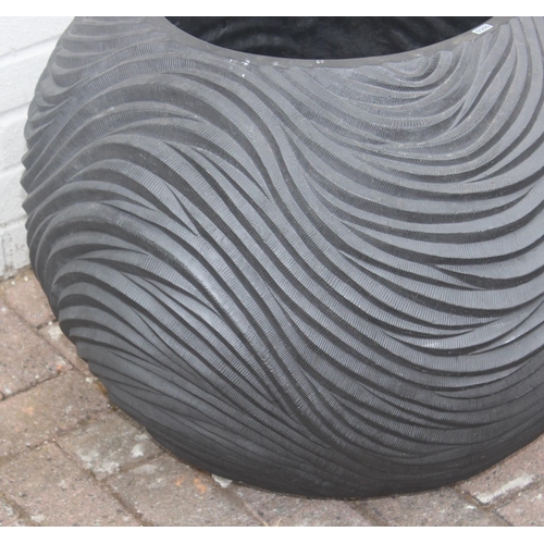 355 - A pair of black fiberglass boat shaped planters of wavy textured form, each approx 74cm x 24cm x 26c... 