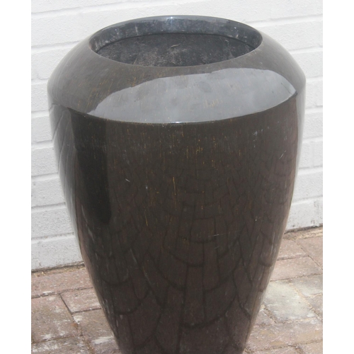 357 - A pair of black streaky glaze effect fiberglass garden planters, each approx 50cm x 68cm tall