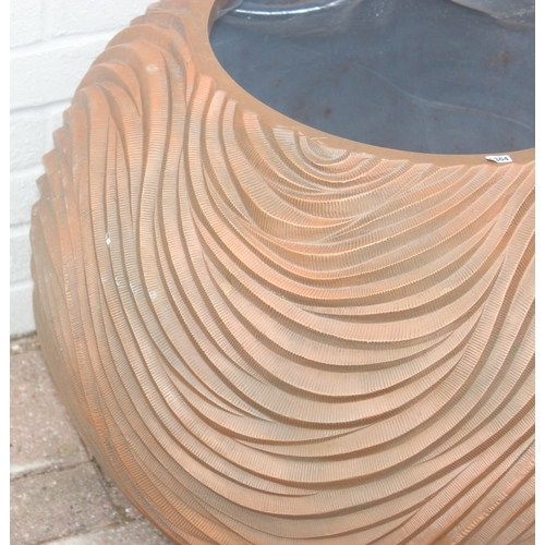 364 - A copper coloured fiberglass planter of spherical form with wavy textured design, approx 65cm wide x... 