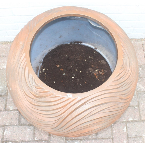 364 - A copper coloured fiberglass planter of spherical form with wavy textured design, approx 65cm wide x... 