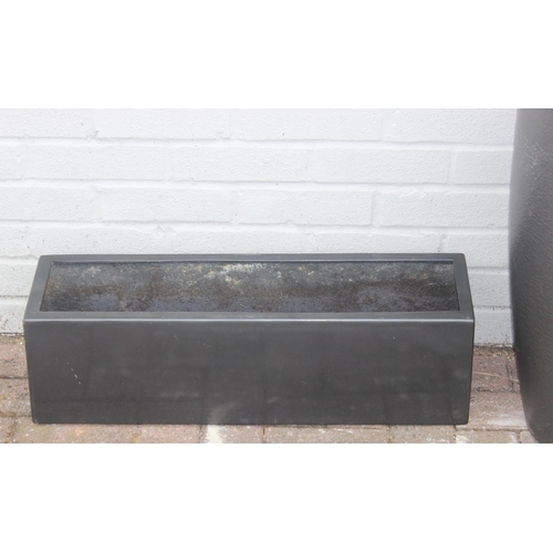 367 - 3 graphite grey coloured fiberglass or plastic garden planters of various forms, the largest approx ... 