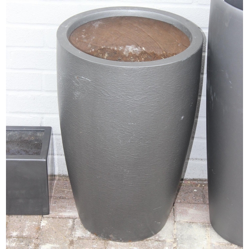 367 - 3 graphite grey coloured fiberglass or plastic garden planters of various forms, the largest approx ... 