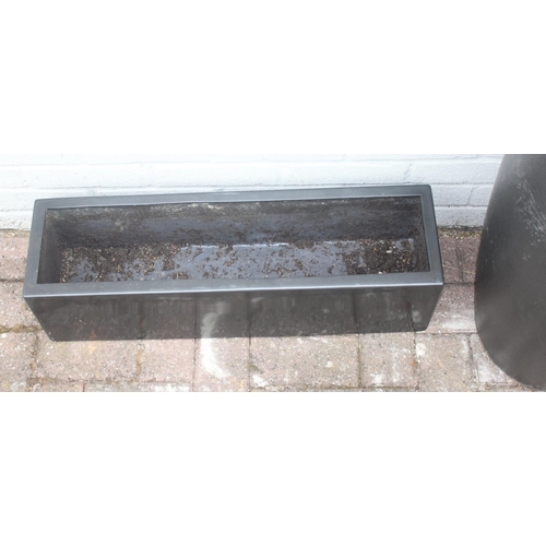 367 - 3 graphite grey coloured fiberglass or plastic garden planters of various forms, the largest approx ... 