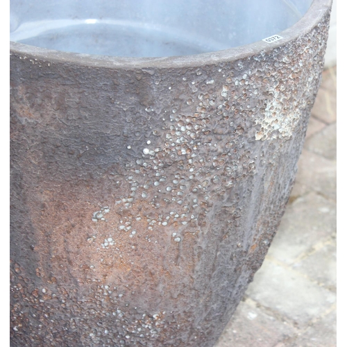 372 - A pair of interesting textured garden planters of circular tapered form, each approx 43cm in diamete... 