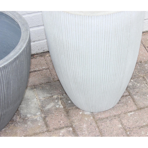 373 - 2 grey pottery garden planters with fluted design, the tallest approx 40cm in diameter x 55cm tall