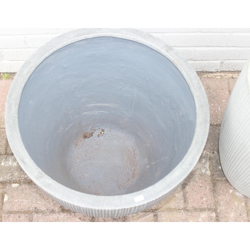 373 - 2 grey pottery garden planters with fluted design, the tallest approx 40cm in diameter x 55cm tall